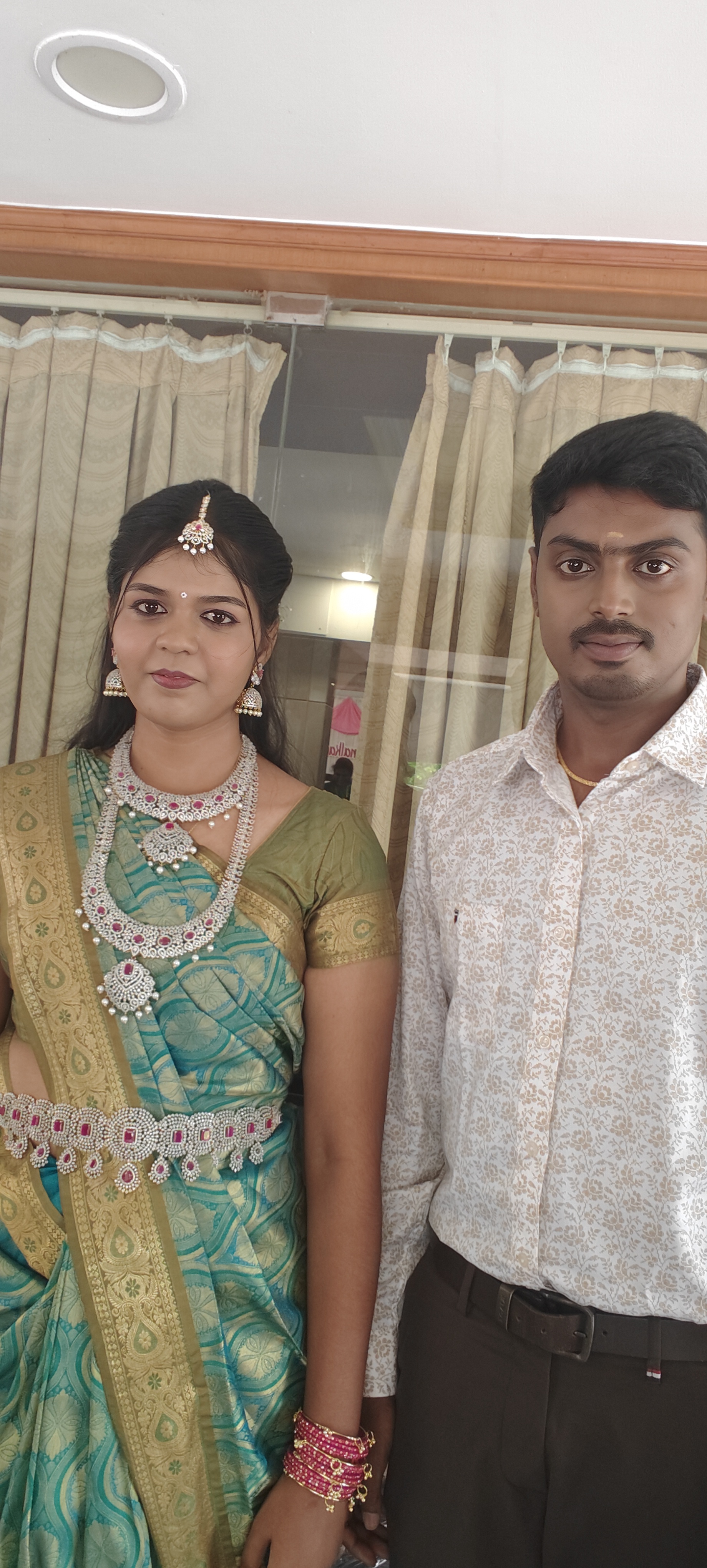 Client styled in silk saree with diamond jewellery