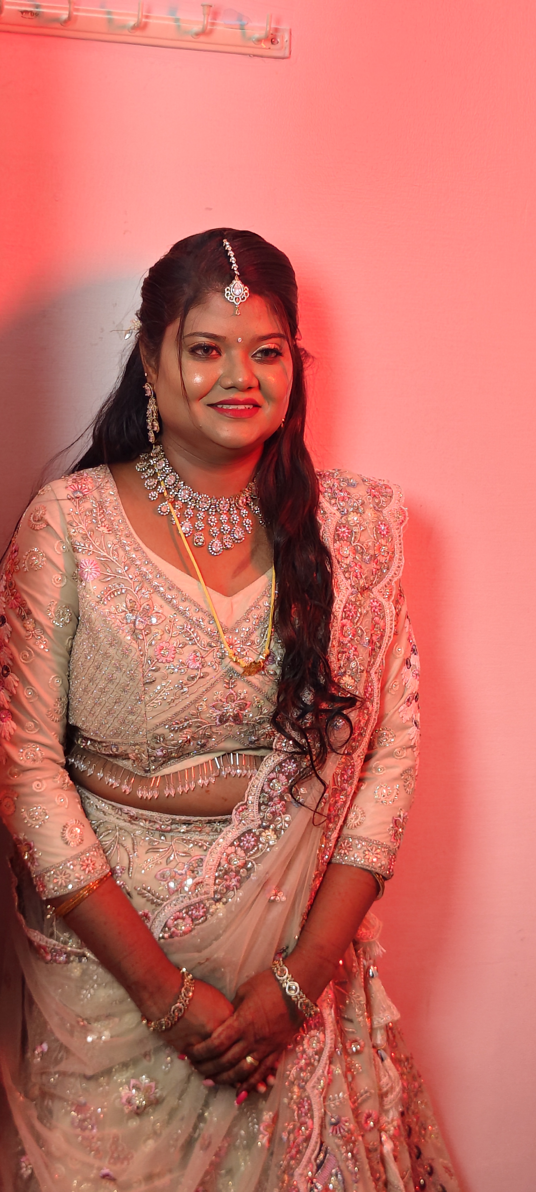 Client styled in pastel lehenga for a reception